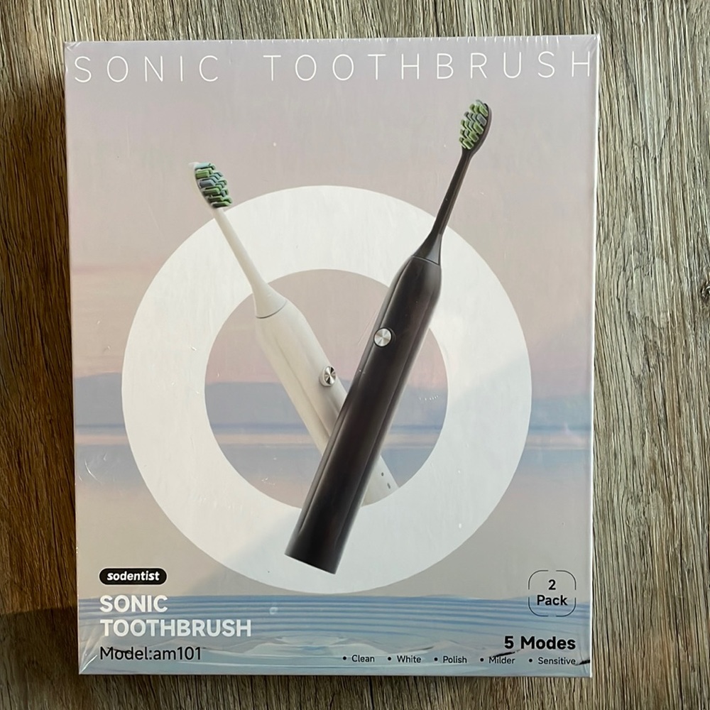 Brand new still in plastic package , 2 electric toothbrushes!